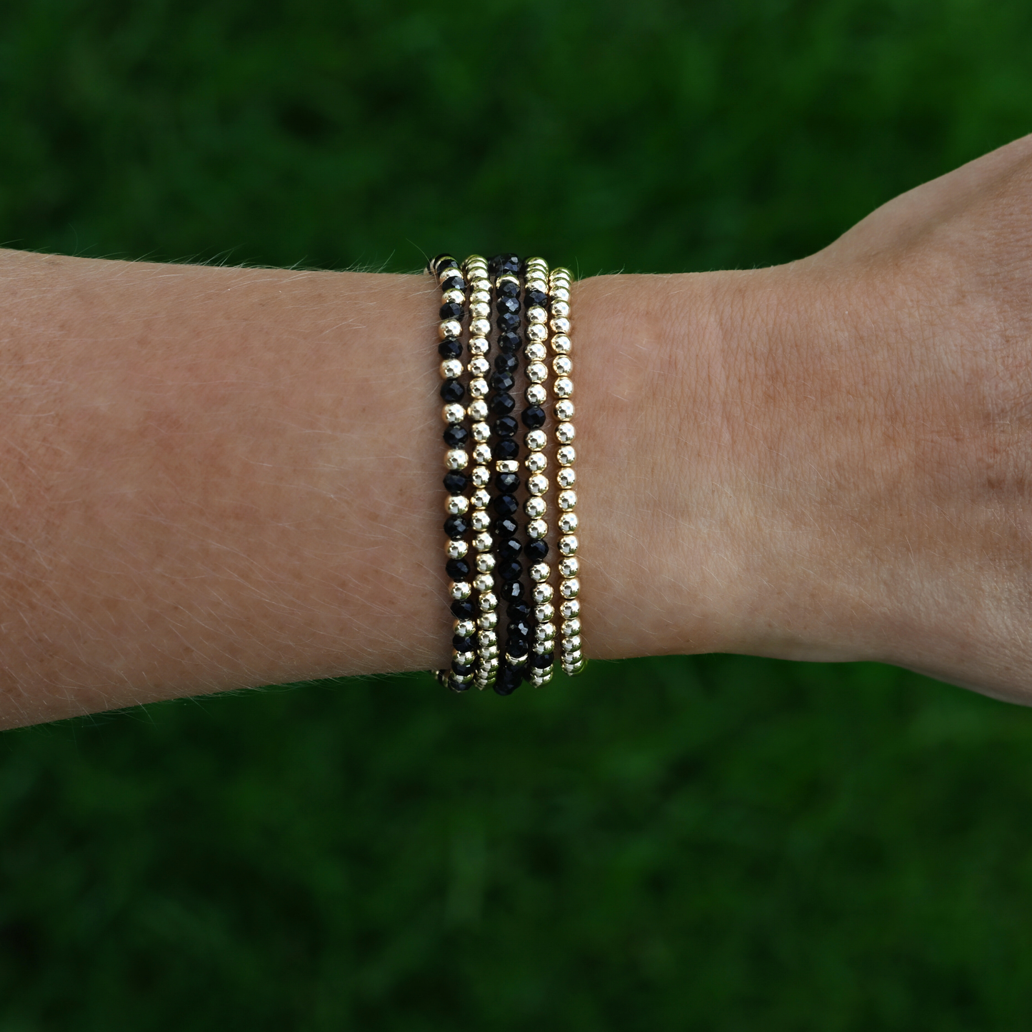 Black onyx and gold bracelet designed by Shannon Hudson for active lifestyles