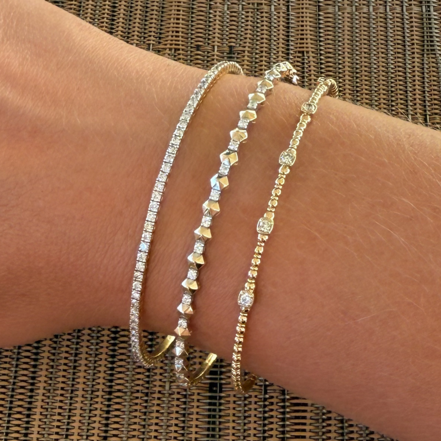 Close up of a diamond bracelet stack for the collection Gold Club by Shannon Hudson.