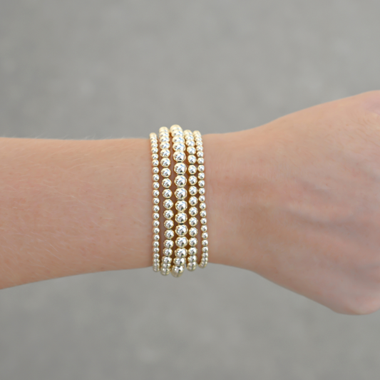 LustraFlex™ gold-filled beaded bracelet by Gold Club on a neutral background.