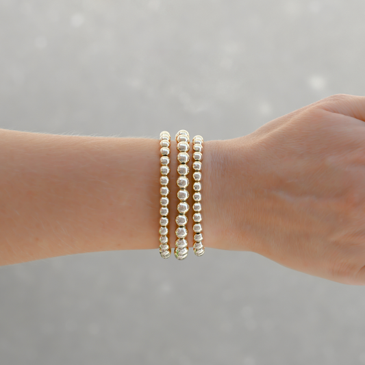 LustraFlex™ gold-filled beaded bracelet by Gold Club on a neutral background.