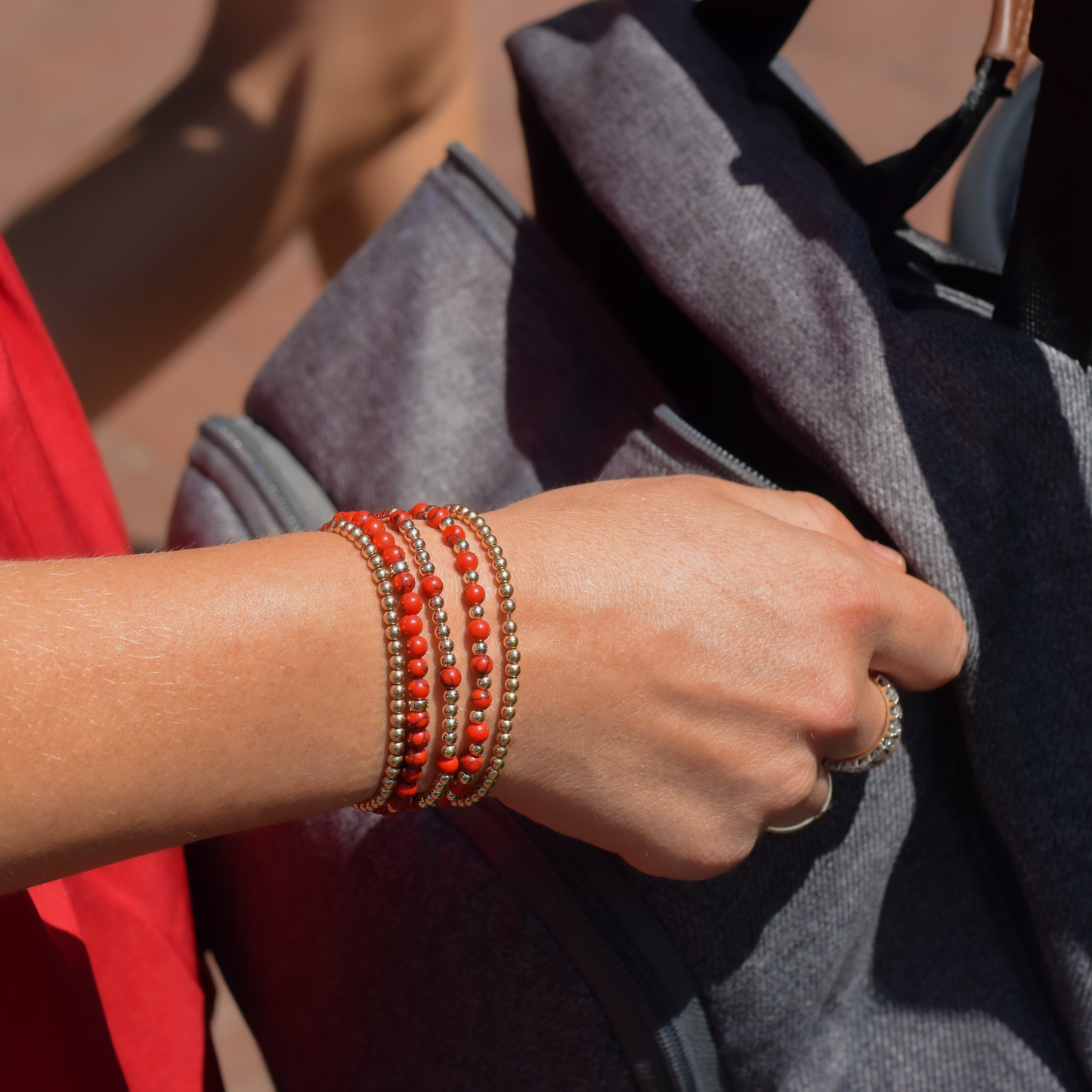 A mom wearing Razorback jewelry styled in Fayetteville Arkansas. Pieces are from Gold Club by Shannon Hudson Everyday collection.