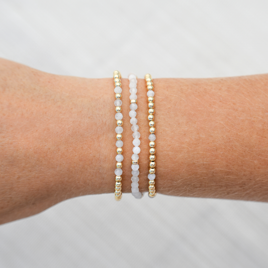 Styled wrist stack with White Moonstone bracelets and 14k gold-filled beads from Gold Club by Shannon Hudson