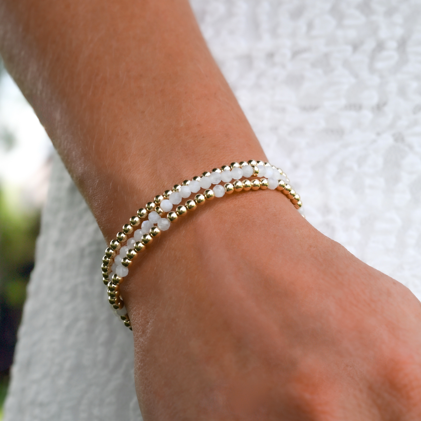 Gold Club LustraFlex™ gemstone bracelets styled for an on-the-go lifestyle