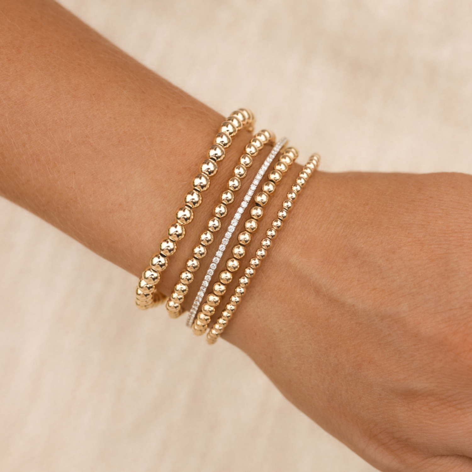 LustraFlex™ gold-filled beaded bracelet by Gold Club on a neutral background.
