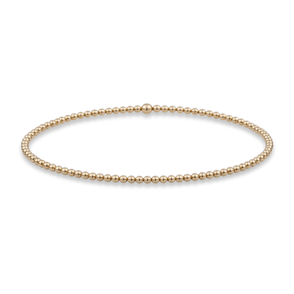 2mm gold bead bracelet from gold club jewelry house by shannon hudson on a transparent background