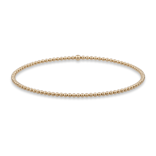2mm gold bead bracelet from gold club jewelry house by shannon hudson on a transparent background