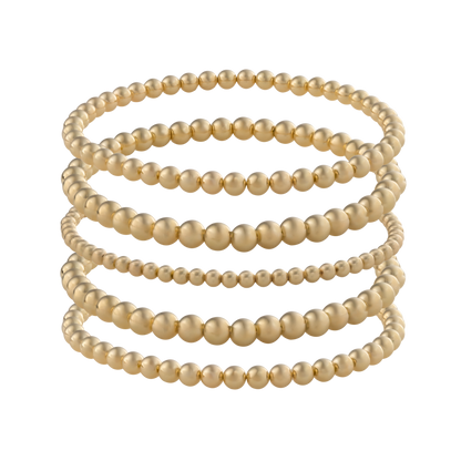 Minimalist gold-filled bracelet stack with flexible LustraFlex™ cord, part of the Gold Club by Shannon Hudson collection