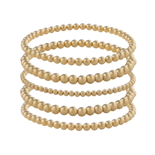 Minimalist gold-filled bracelet stack with flexible LustraFlex™ cord, part of the Gold Club by Shannon Hudson collection