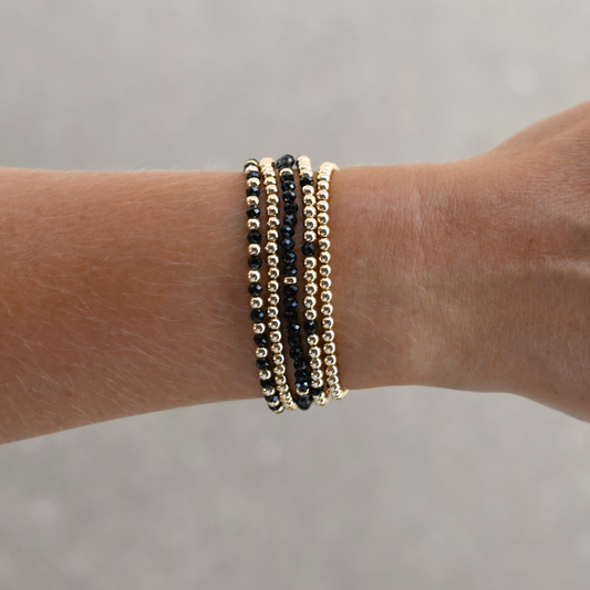 LustraFlex™ stretch bracelets with faceted black onyx beads and 14k gold-filled accents