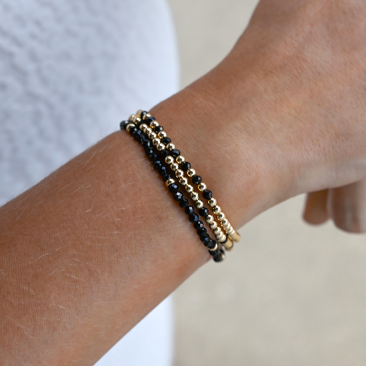 Black onyx and gold bracelet designed by Shannon Hudson for an active lifestyle and busy moms