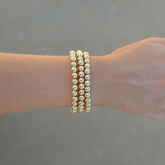 Three Large Gold LustraFlex™ bracelets by Shannon Hudson