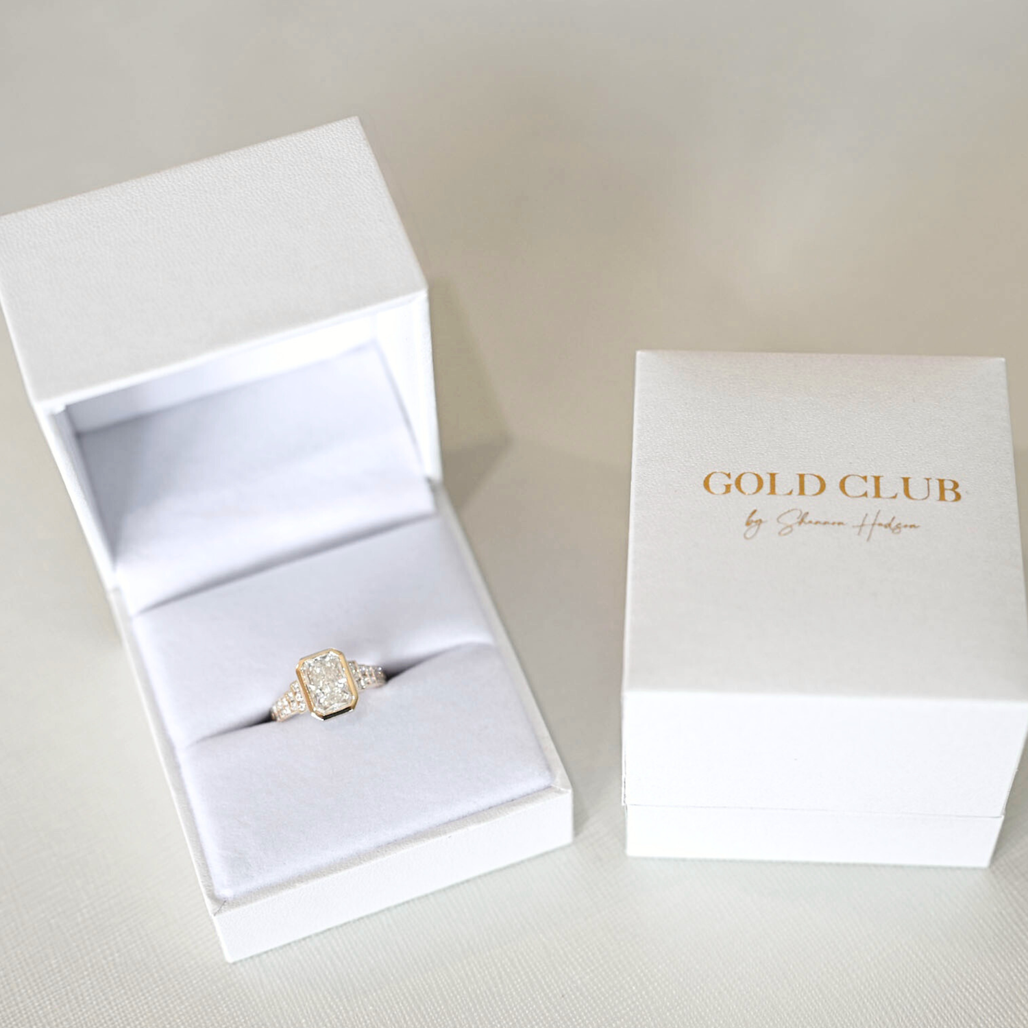 A Gold Club engagement ring in beautiful packaging.