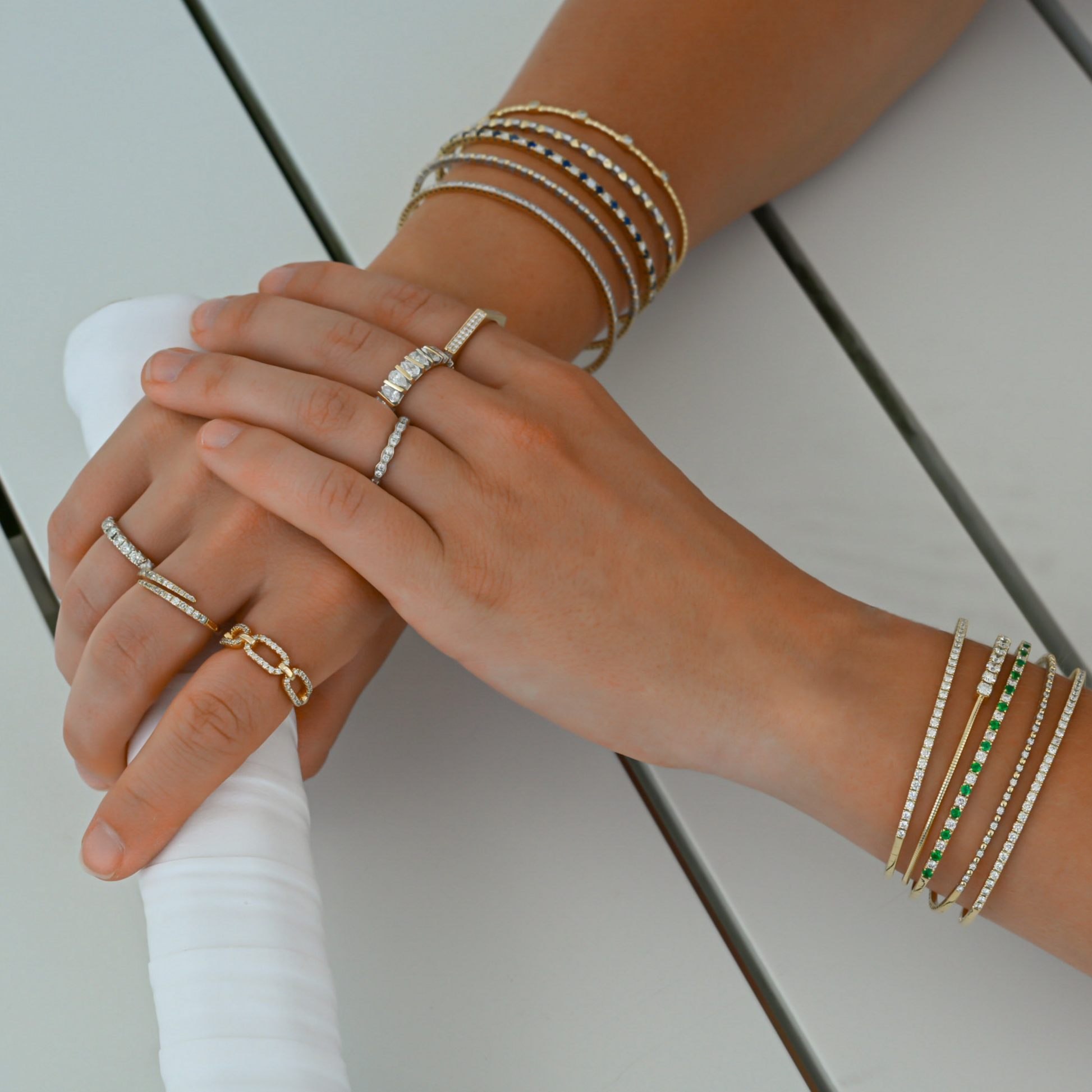 A close up of the fine jewelry collection by Gold Club by Shannon Hudson. Active luxury jewelry that you can play in.