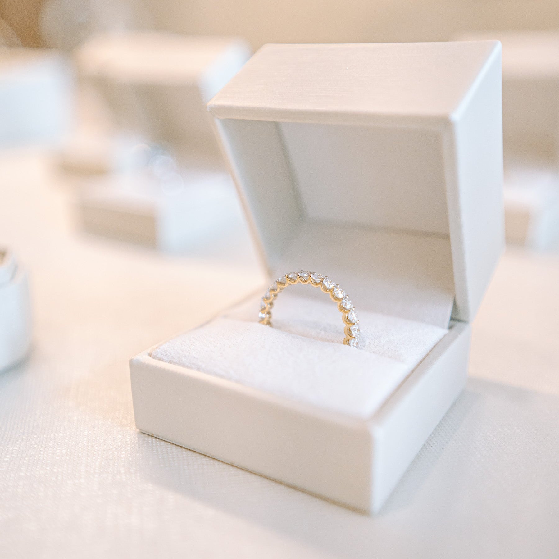 A lab grown diamond eternity band in a luxury ring box from Gold Club by Shannon Hudson