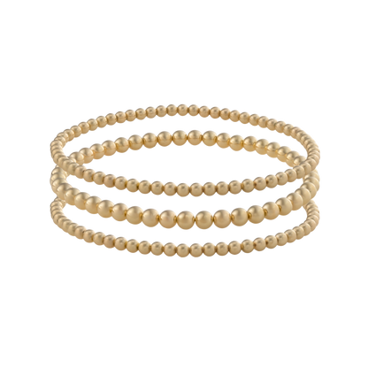 Close-up of Gold Club’s LustraFlex™ gold-filled bracelet stack Golden Luxe