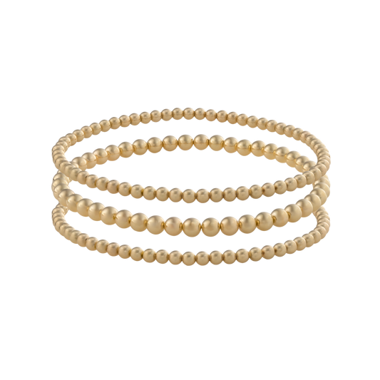 Close-up of Gold Club’s LustraFlex™ gold-filled bracelet stack Golden Luxe