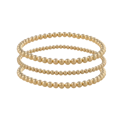 Gold Filled LustraFlex™ bracelets on transparent background