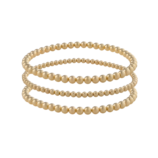 Gold Filled LustraFlex™ bracelets on transparent background