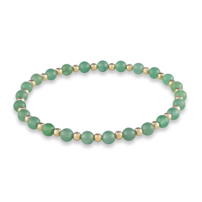 Balanced bracelet with alternating green agate and gold-filled beads, symbolizing harmony and grounded energy.