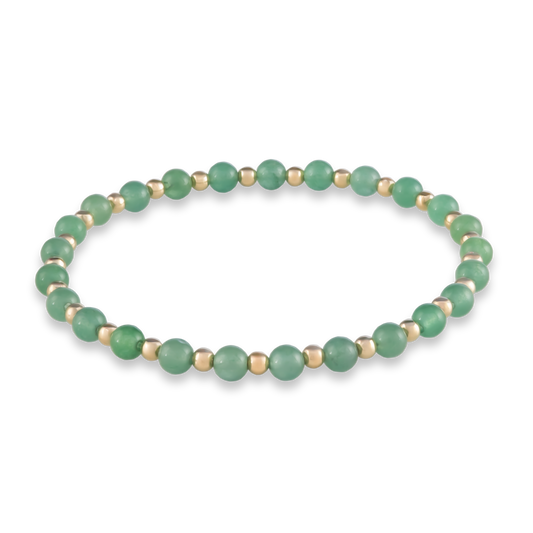 Balanced bracelet with alternating green agate and gold-filled beads, symbolizing harmony and grounded energy.