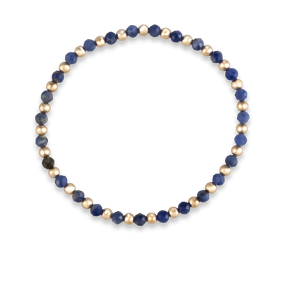 Balanced gemstone bracelet by Shannon Hudson featuring natural kyanite
LustraFlex™ stacking bracelet with blue kyanite and 14k gold-filled beads overhead shot.