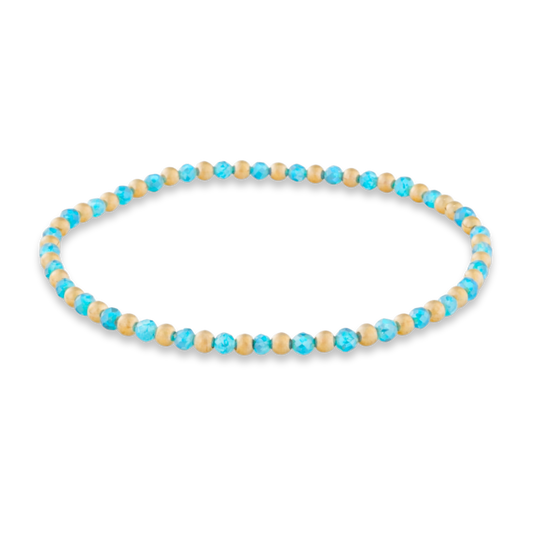 Beaded necklace with blue and beige beads on a white background