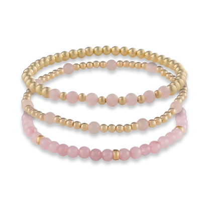 Digital rendering of the Pink Quartz Mini Stack featuring three handcrafted bracelets in rose quartz and gold-filled elements.