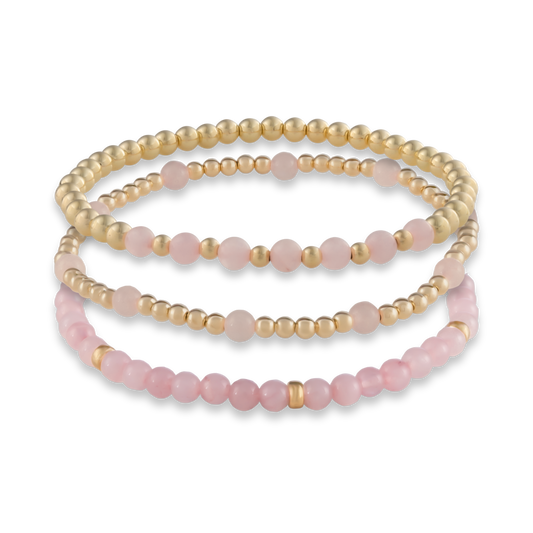 Digital rendering of the Pink Quartz Mini Stack featuring three handcrafted bracelets in rose quartz and gold-filled elements.