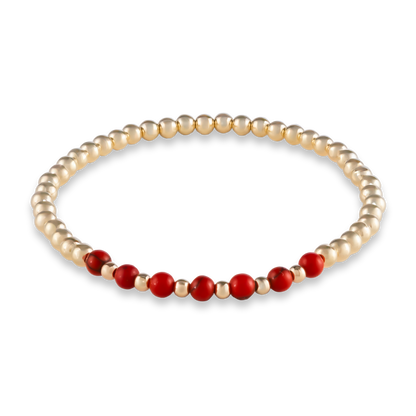 Minimalist gold-filled bracelet with red agate gemstones in a curved design from GOLD CLUB by Shannon Hudson.