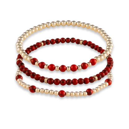 Three-piece Red Agate Mini Stack from GOLD CLUB featuring Arc, Muse, and Sun bracelets in matching red agate gemstones.