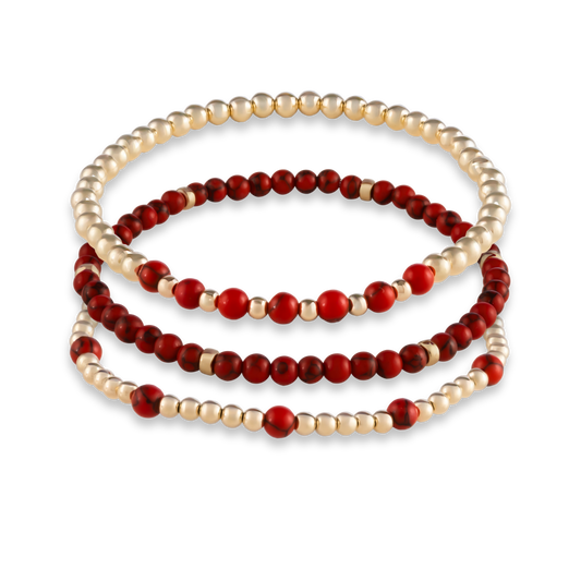 Three-piece Red Agate Mini Stack from GOLD CLUB featuring Arc, Muse, and Sun bracelets in matching red agate gemstones.
