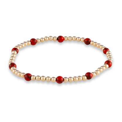 Signature GOLD CLUB Muse bracelet featuring red agate gemstones on a LustraFlex™ gold-filled band.