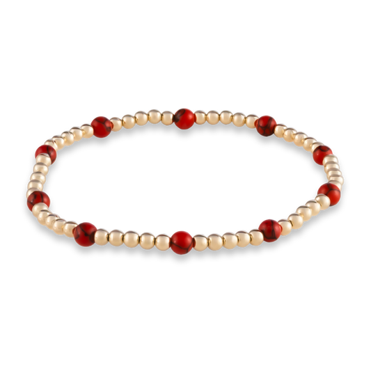 Signature GOLD CLUB Muse bracelet featuring red agate gemstones on a LustraFlex™ gold-filled band.