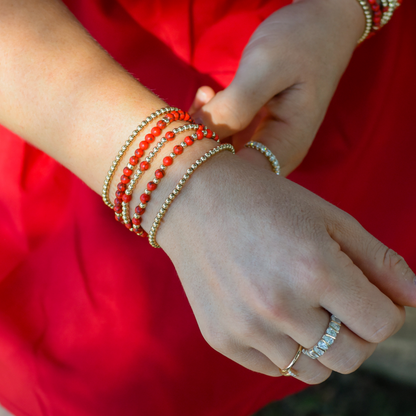 Razorback Jewelry styled on a women's wrist in Downtown Bentonville. Pieces from Gold Club by Shannon Hudson Everyday collection.