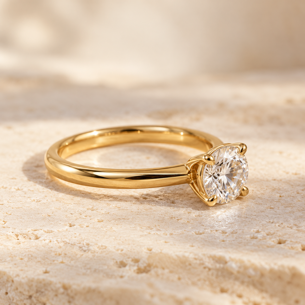 Yellow gold solitaire diamond ring on limestone, illustrating Gold Club jewelry repair services.