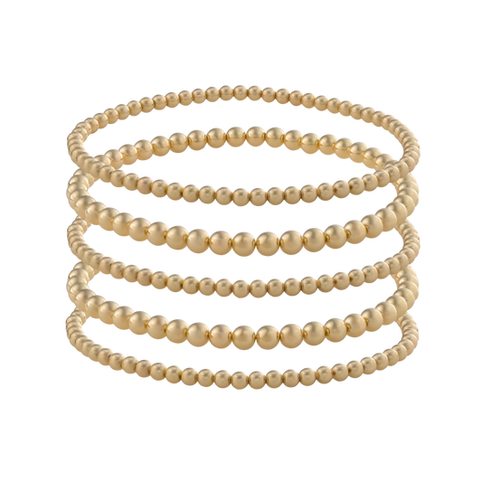 Set of five Gold Club by Shannon Hudson Gold LustraFlex™ Bracelets on a transparent background