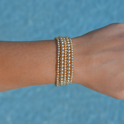 Signature Stack Gold Club by Shannon Hudson bracelet styled for a casual pool party.