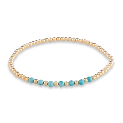 Clean digital rendering of the Turquoise Arc bracelet featuring a curved row of vivid turquoise beads framed by polished gold.