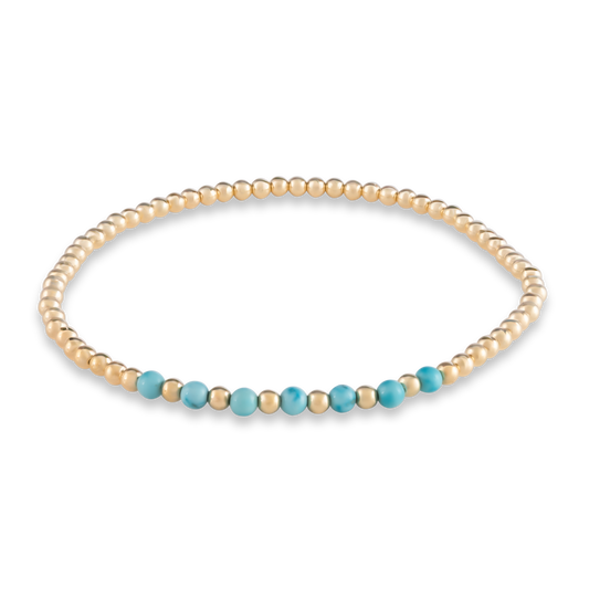 Clean digital rendering of the Turquoise Arc bracelet featuring a curved row of vivid turquoise beads framed by polished gold.