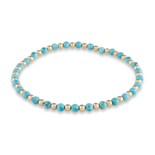 Alternating turquoise and gold-filled beads in a centered, symmetrical bracelet design—crafted for bold balance and wearable intention.