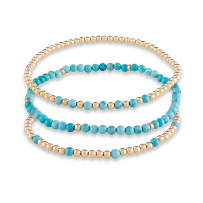 Rendering of the Turquoise Mini Stack, a curated trio of gemstone and gold bracelets for intentional layering and statement simplicity.