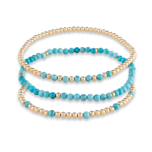 Rendering of the Turquoise Mini Stack, a curated trio of gemstone and gold bracelets for intentional layering and statement simplicity.