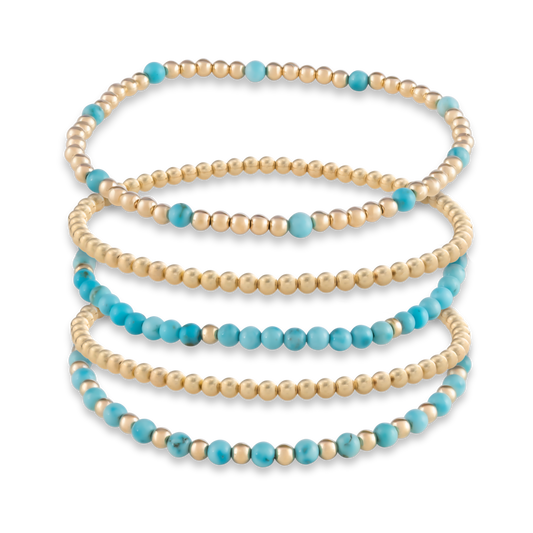 Digital rendering of the Turquoise Signature Stack, featuring five bold yet balanced bracelets in turquoise and gold-filled beads.