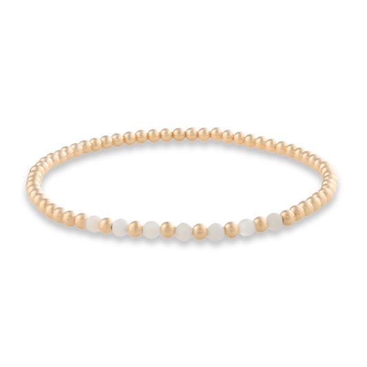 Stretch-fit moonstone arc bracelet from Gold Club’s active-luxe collection
