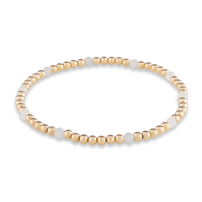 White Moonstone Muse bracelet from Gold Club by Shannon Hudson with scattered gemstone accents and gold-filled beads