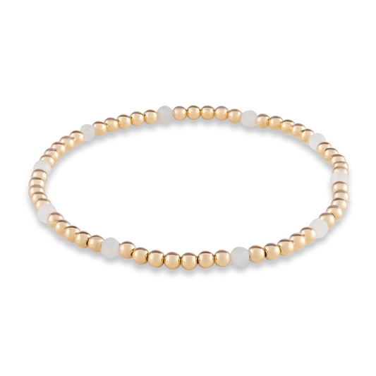 White Moonstone Muse bracelet from Gold Club by Shannon Hudson with scattered gemstone accents and gold-filled beads