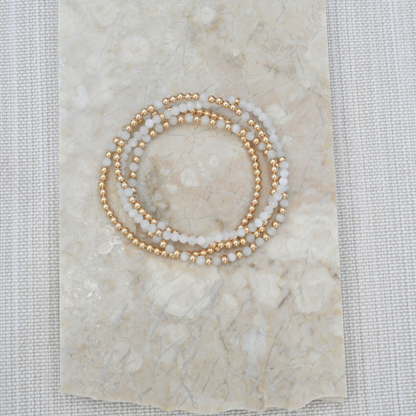 Natural White Moonstone and gold filled bracelet Stack catching the light in outdoor setting