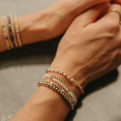 Gold Club by Shannon Hudson White Moonstone LustraFlex™ Bracelet with white moonstone gemstones and 14k gold-filled beads, layered stack